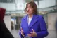 Health Secretary Victoria Atkins talks to the media outside 