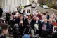 Members of Covid Bereaved England, holding photographs of th