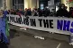 Health workers form a blockade in Soho Square during a prote