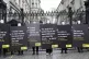 Demonstrators from Amnesty International, dressed in black a
