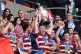 Wigan Warriors' Liam Farrell (centre) lifts the trophy with 