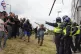 Fascist goons throw objects towards police officer at the Ho