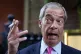 Reform UK leader Nigel Farage smoking outside the Westminste