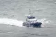 A group of people are brought in to Dover, Kent, onboard a B