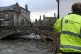 An Environment Agency officer inspecting a scene in Cockermo