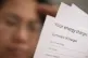 A person holding an energy bill, January 8, 2022