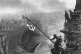 RED FLAG FLYING: The Soviet flag is hoisted over the Reichst