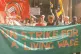 Striking cleaners and supporters demonstrate outside the Min