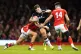 Scotland's Huw Jones is tackled by Wales' Mason Grady (left)
