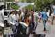 People carry away a wounded man from the scene of a car bomb