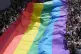 Participants hold a rainbow flag during a Pride Parade in Ba