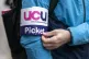 A person wearing a University and College Union (UCU) armban
