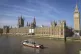 A protest boat passes by the Houses of Parliament