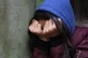 A teenage girl with her head in her hands (picture posed by 