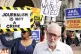 THE WRITING IS ON THE PLACARDS: Jeremy Corbyn arrives at the