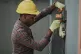 Black worker Emmanuel Ikwuegbu / Creative Commons
