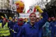Women sing against French President Emmanuel Macron on a pen