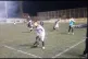 Players struggle to breath after tear gas is fired onto the 