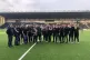Widnes Viking staff, gathered on the pitch at Halton Stadium