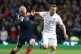 Steven Naismith in action for Scotland as he attempts to tac