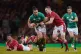 Ireland's James Lowe is tackled by Wales' Taulupe Faletau (l