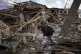 Anna Shevchenko, 35, waters the few flowers that survived in