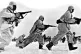 Soviet soldiers advance through the snow