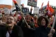 Women march on the first day of the strike for equal pay