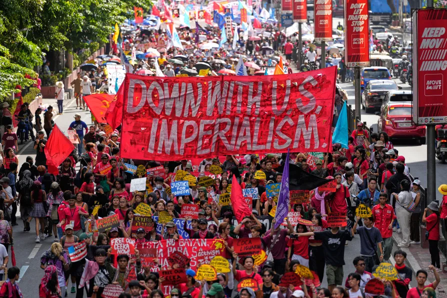 Protesters march towards the Malacanang Presidential palace during a May Day rally in Manila, Philippines on Friday, May 1, 2026