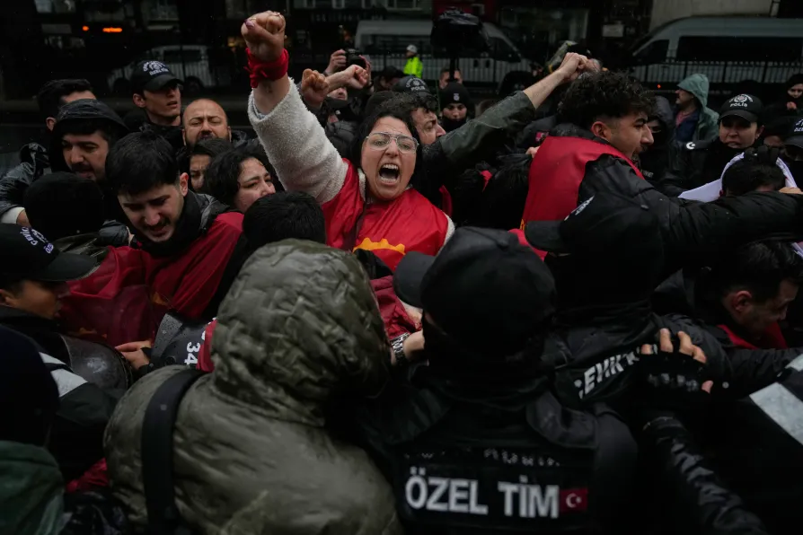 Union members scuffle with Turkish police officers as they try to march towards Taksim square in Istanbul, Turkey, Friday, May 1, 2026, during Labor Day celebrations