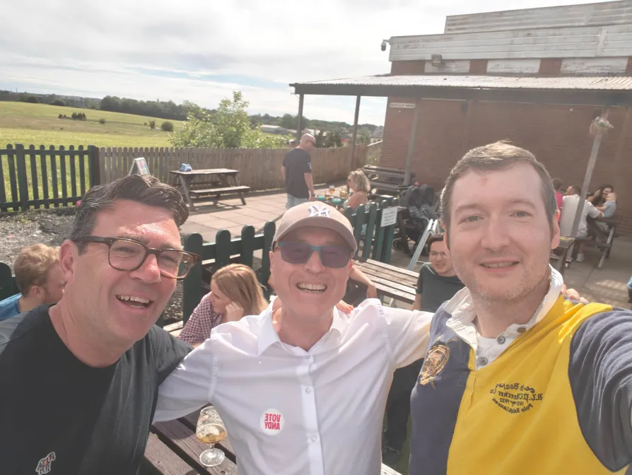 Sam Wheeler (right) with Councillor Basil Curley and Andy Burnham